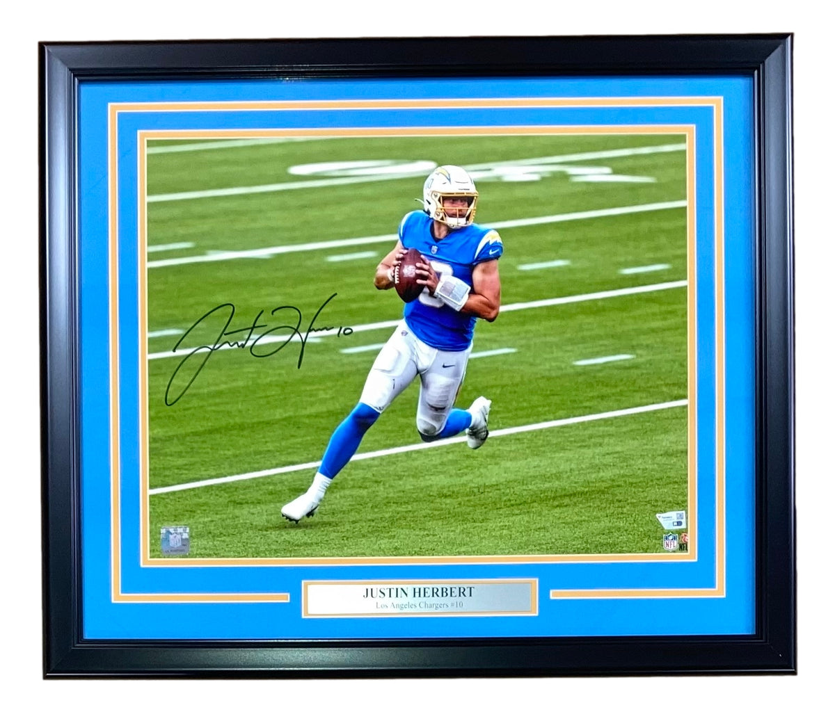 Justin Herbert Los Angeles Chargers Autographed 16 x 20 Royal Jersey  Throwing Photograph